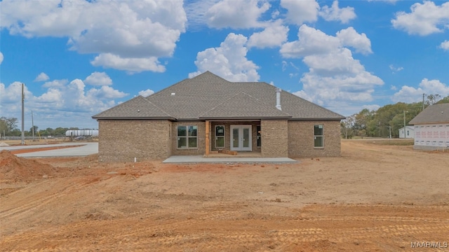 back of property with a patio and french doors