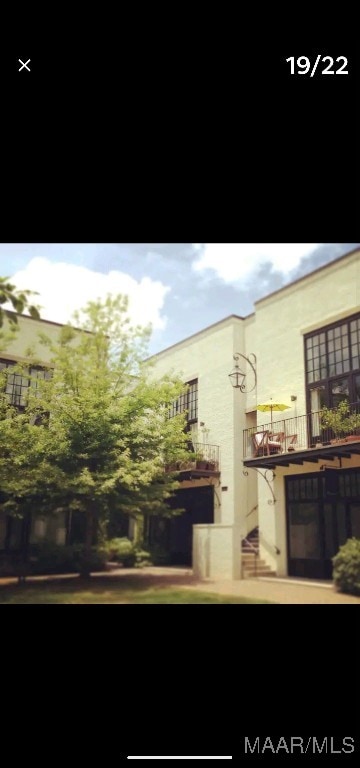 view of property exterior featuring a balcony