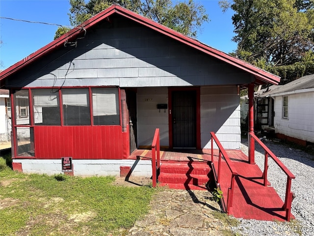 view of front facade featuring a sunroom