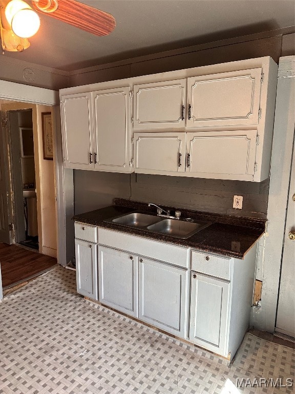 kitchen with sink and white cabinetry