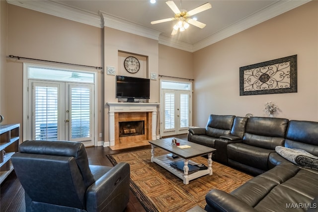 living room with hardwood / wood-style flooring, ceiling fan, a healthy amount of sunlight, and french doors