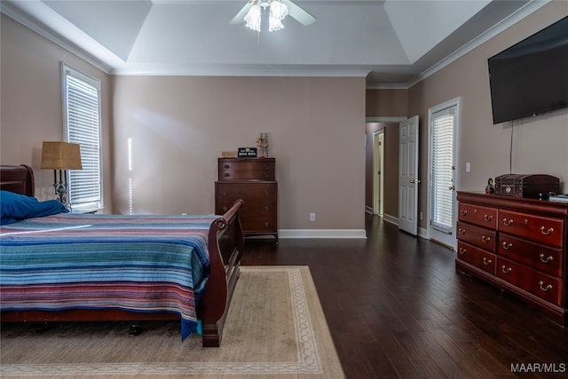 bedroom featuring ceiling fan, dark hardwood / wood-style flooring, vaulted ceiling, and ornamental molding