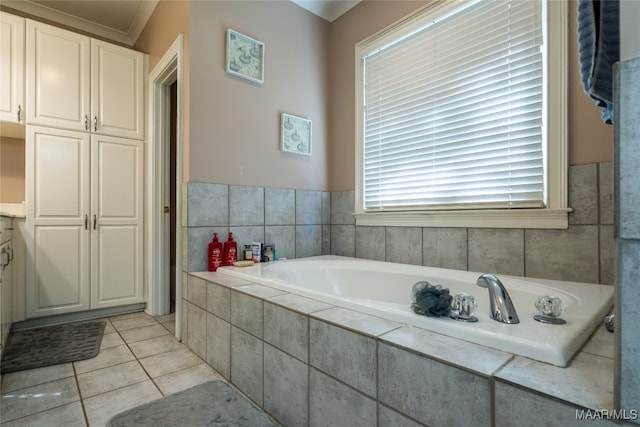 bathroom with tiled tub, tile patterned flooring, vanity, and ornamental molding