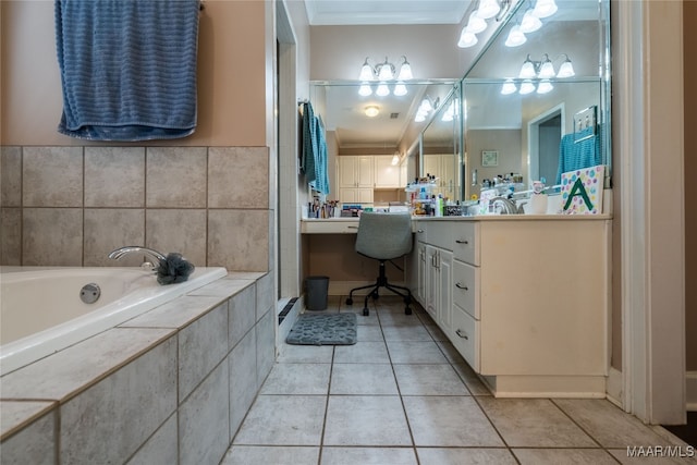 bathroom with tile patterned floors, vanity, and a relaxing tiled tub