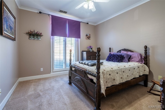 carpeted bedroom featuring ceiling fan and ornamental molding