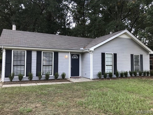 ranch-style house with a front lawn