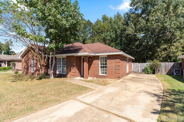 single story home with a front yard