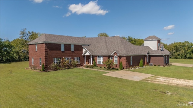 view of front facade with a garage and a front lawn