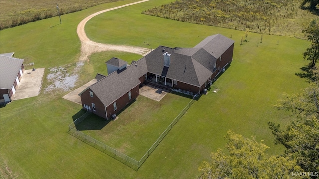 birds eye view of property with a rural view