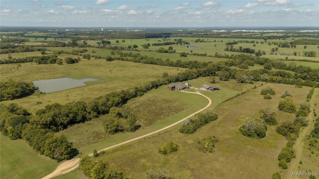 birds eye view of property featuring a rural view