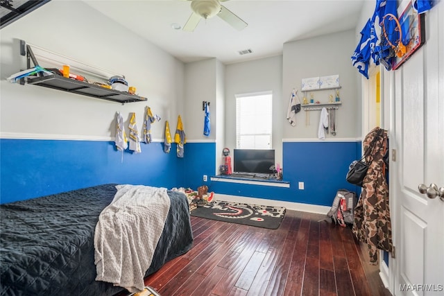 bedroom with ceiling fan and hardwood / wood-style floors