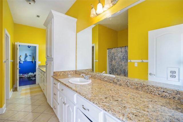 bathroom featuring tile patterned floors and vanity