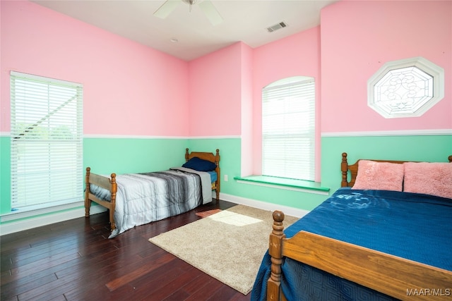 bedroom featuring ceiling fan and dark hardwood / wood-style flooring