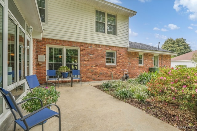 back of house with a patio