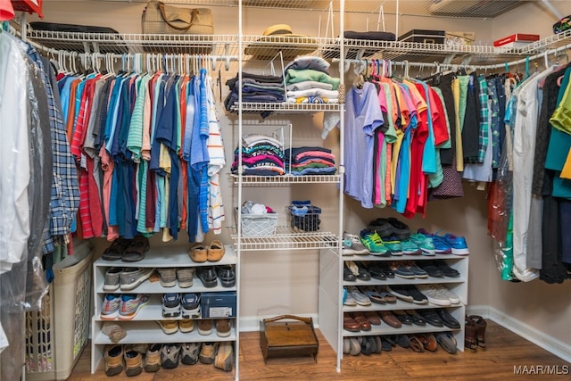 spacious closet featuring hardwood / wood-style floors