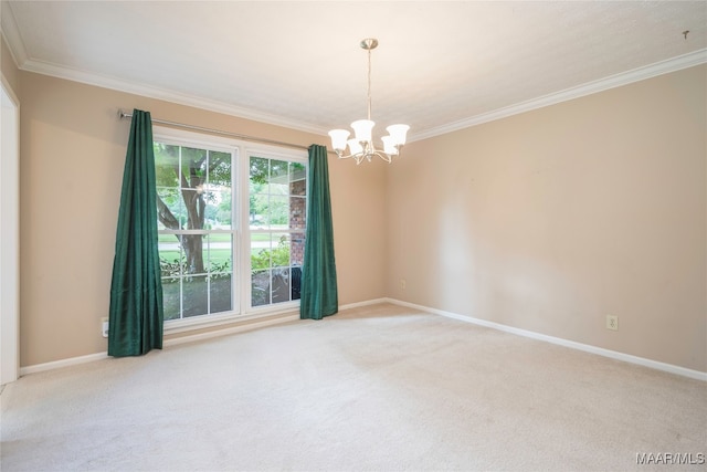 spare room featuring an inviting chandelier, ornamental molding, and carpet