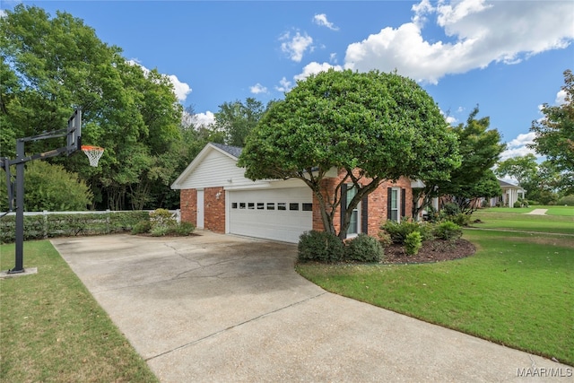 view of home's exterior featuring a garage and a yard