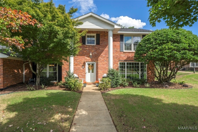 view of front of house with a front lawn