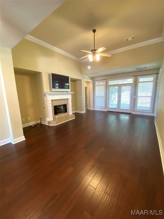 unfurnished living room with crown molding, dark hardwood / wood-style flooring, and ceiling fan