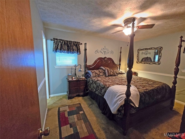 carpeted bedroom featuring a textured ceiling and ceiling fan