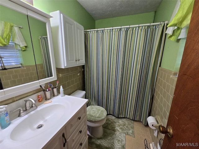 bathroom featuring toilet, a textured ceiling, backsplash, tile patterned floors, and vanity