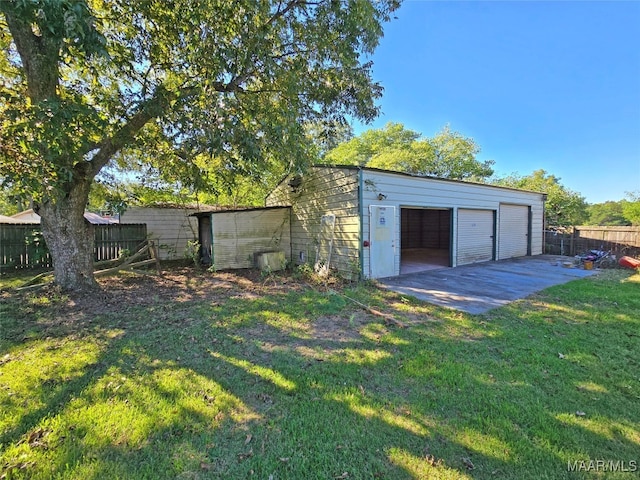 garage with a lawn