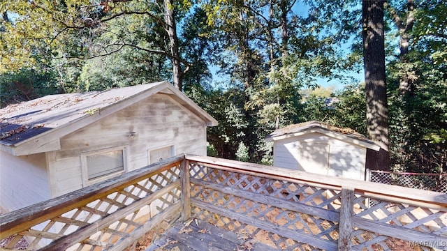 wooden deck featuring a shed