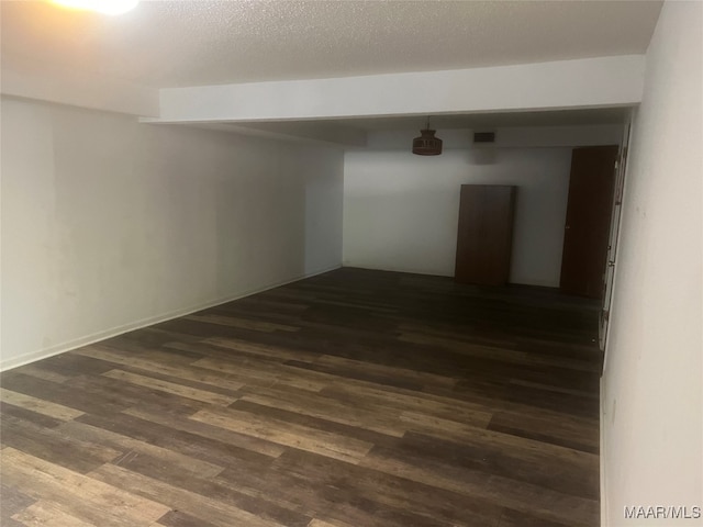 empty room featuring dark wood-type flooring