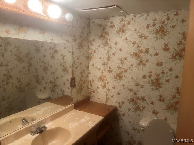 bathroom with vanity and toilet