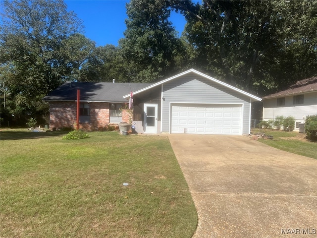 single story home featuring a garage and a front yard