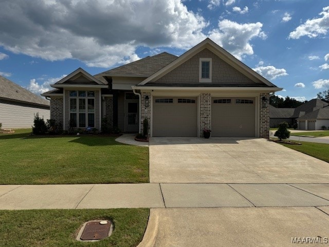 view of front of house featuring a garage and a front yard