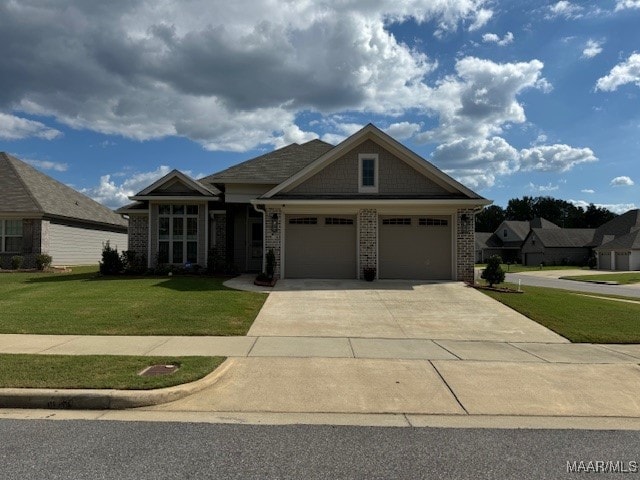 view of front facade with a front lawn and a garage