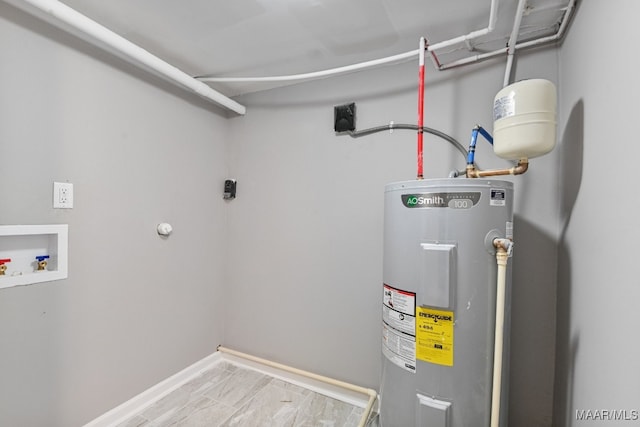 utility room featuring electric water heater