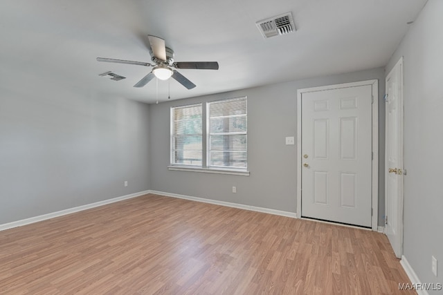 unfurnished room featuring light hardwood / wood-style floors and ceiling fan