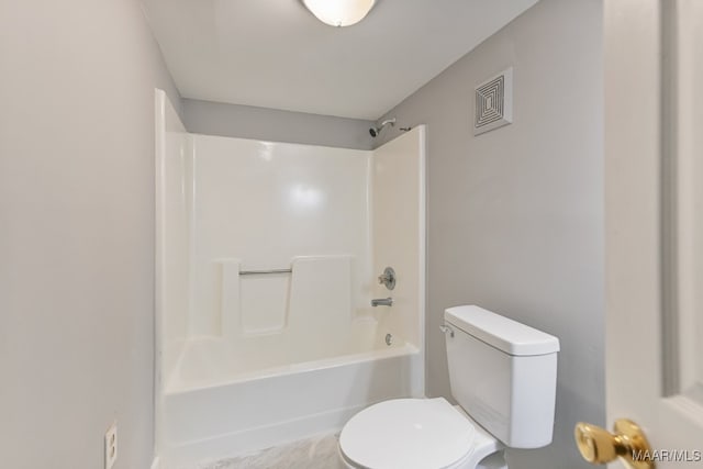 bathroom with shower / bath combination and toilet