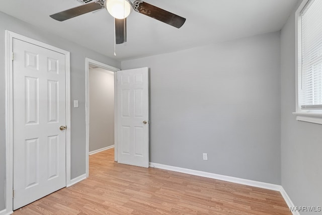 unfurnished bedroom with ceiling fan and light hardwood / wood-style flooring