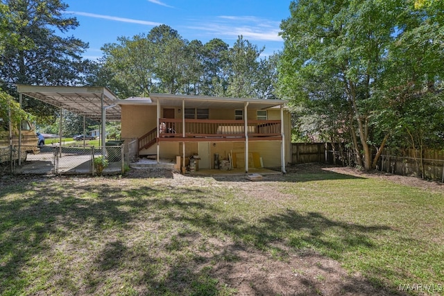 rear view of house featuring a yard