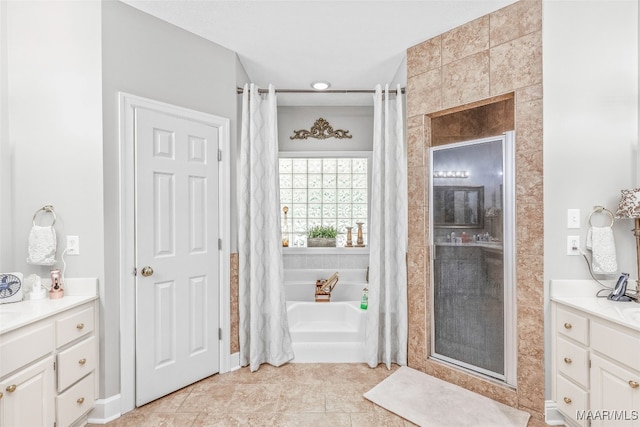 bathroom featuring independent shower and bath and vanity