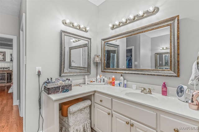 bathroom featuring vanity and wood-type flooring