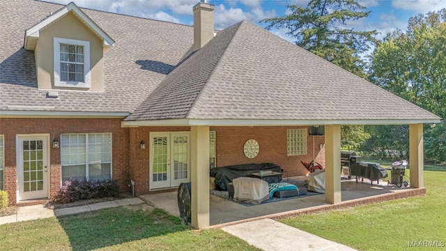 view of front of property with a front yard and a patio area