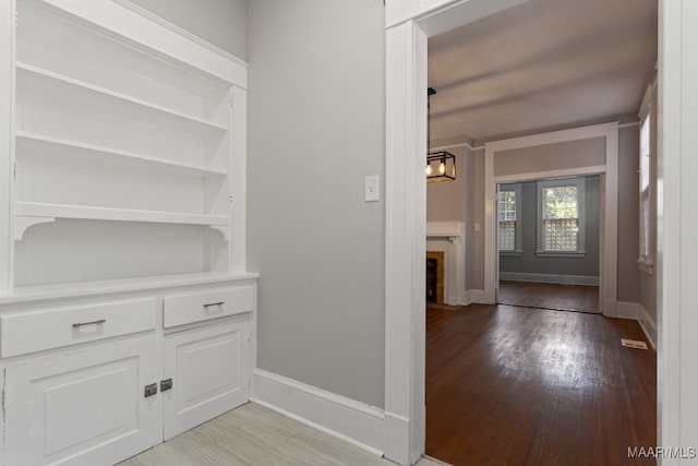 hall with light wood-type flooring