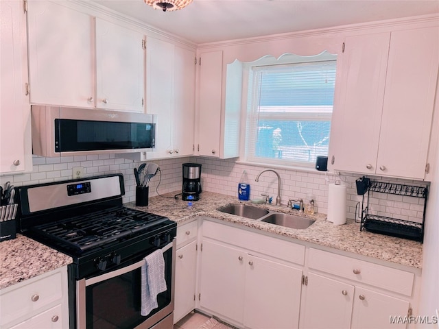 kitchen featuring white cabinetry, sink, and stainless steel appliances