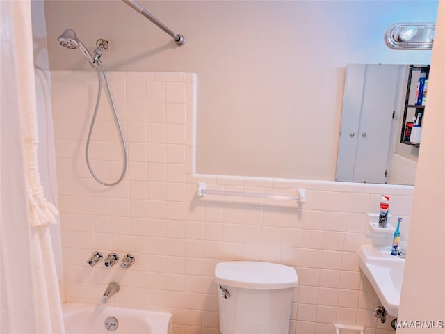 bathroom with tile walls, shower / bath combo with shower curtain, and toilet