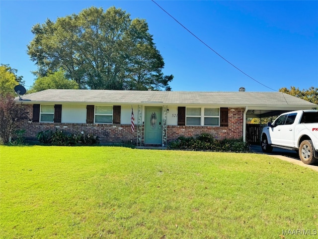 single story home featuring a front yard and a carport