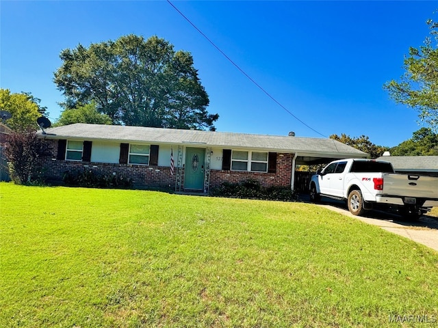 ranch-style house featuring a front lawn and a carport