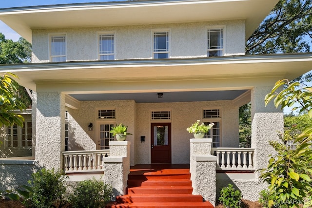 property entrance featuring a porch