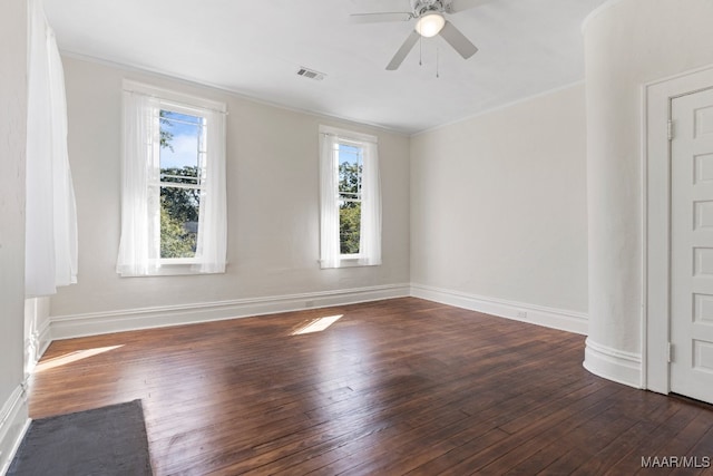 unfurnished room with crown molding, dark hardwood / wood-style flooring, and ceiling fan