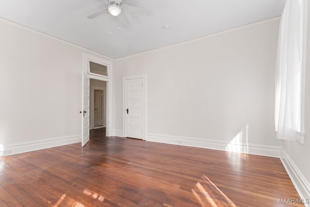 empty room featuring crown molding, ceiling fan, and dark hardwood / wood-style flooring