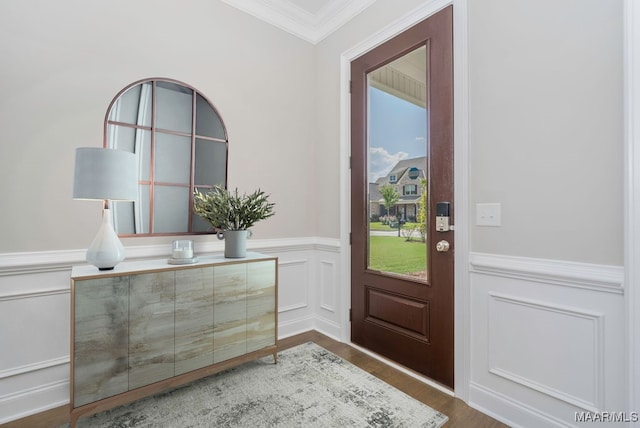 entryway featuring ornamental molding and wood-type flooring