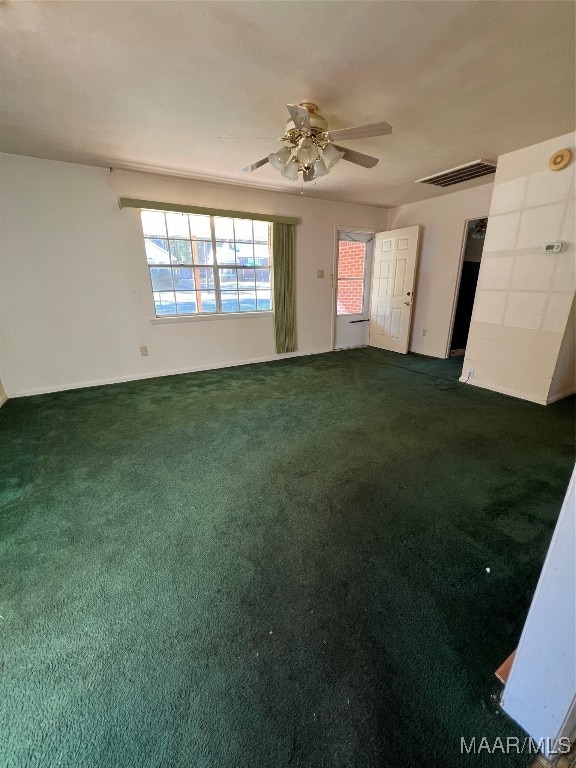 carpeted empty room with ceiling fan